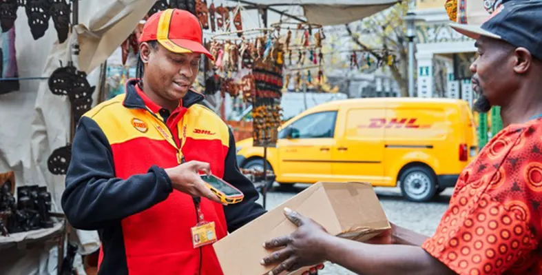 DHL ramping up Africa services. (Image source: DHL) DHL_delivery_man_van_background